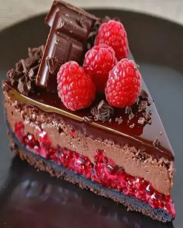 Delicious homemade chocolate cheesecake topped with chocolate shavings