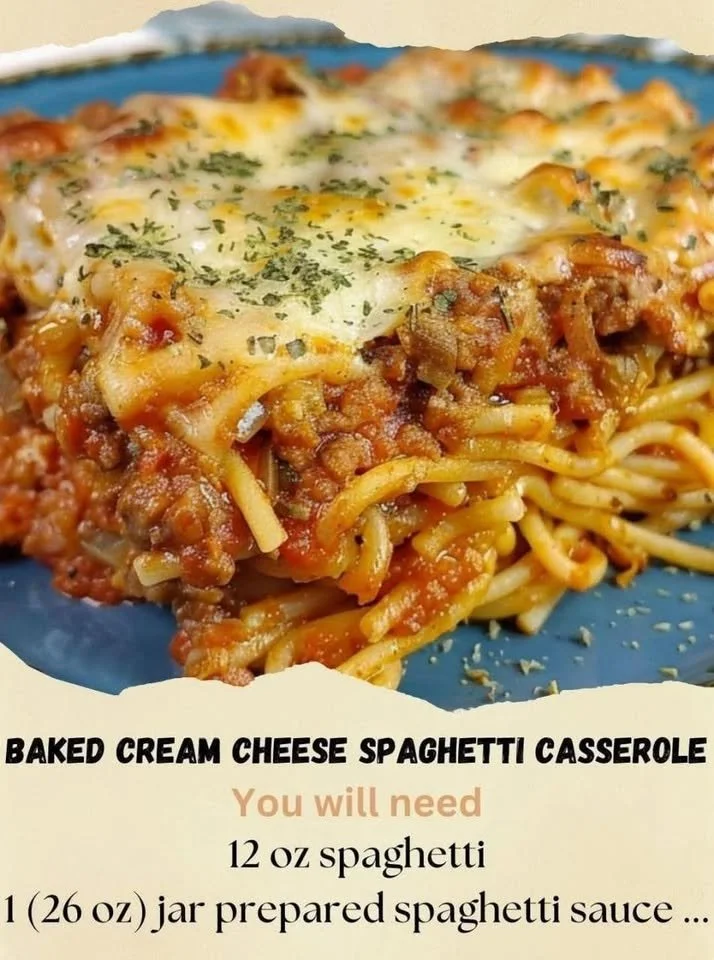Baked cream cheese spaghetti casserole topped with melted cheese and herbs