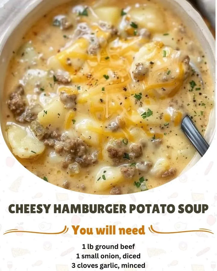 Bowl of cheesy hamburger potato soup garnished with herbs and cheese
