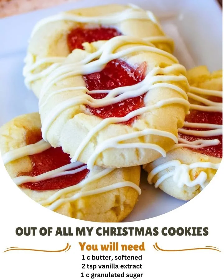 Homemade Christmas cookies filled with raspberry jam on a festive table