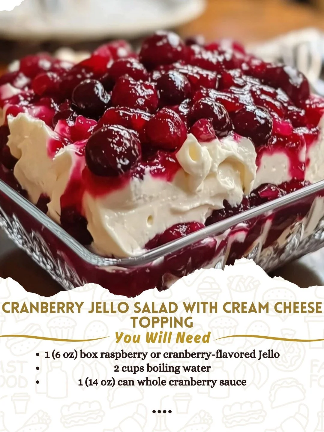 Cranberry Jello Salad topped with cream cheese, served in a decorative bowl.