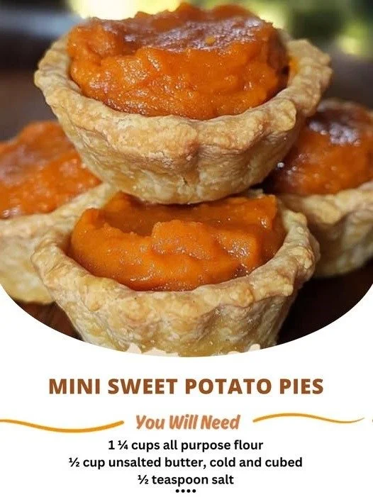 Mini sweet potato pies served on a plate with whipped cream.