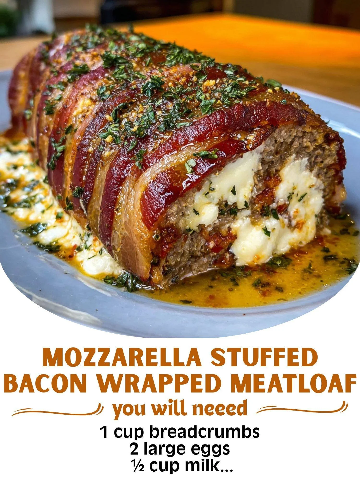 Mozzarella stuffed bacon wrapped meatloaf on a plate with herbs