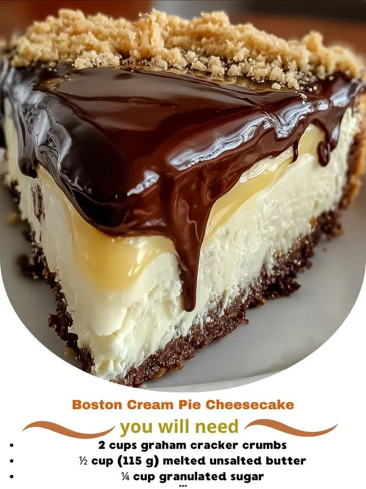 A slice of Boston Cream Pie Cheesecake topped with chocolate ganache and whipped cream