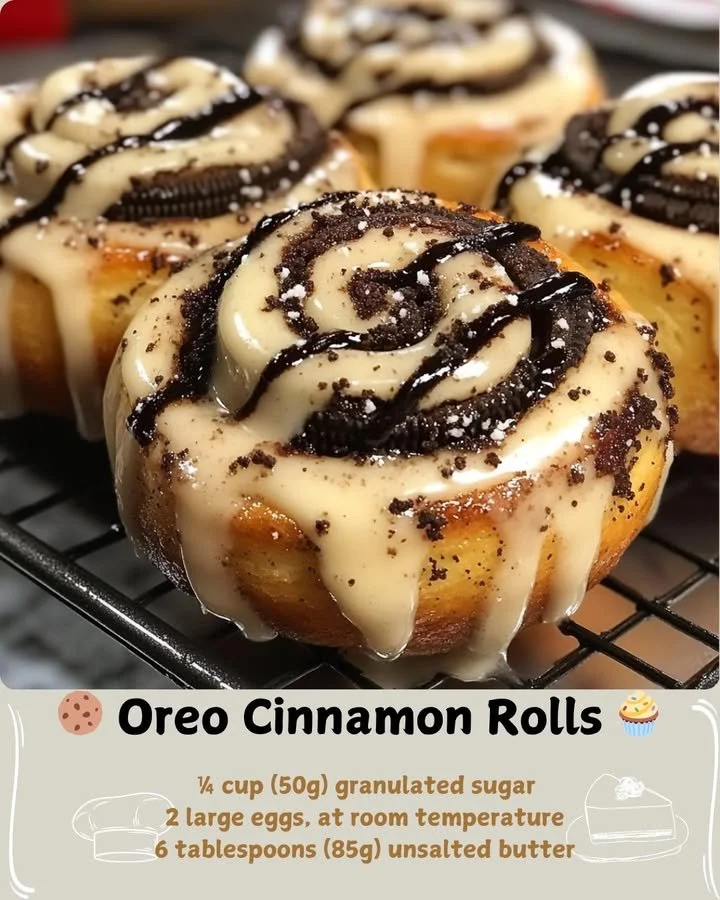 Deliciously layered Oreo cinnamon rolls topped with frosting and crushed Oreos.