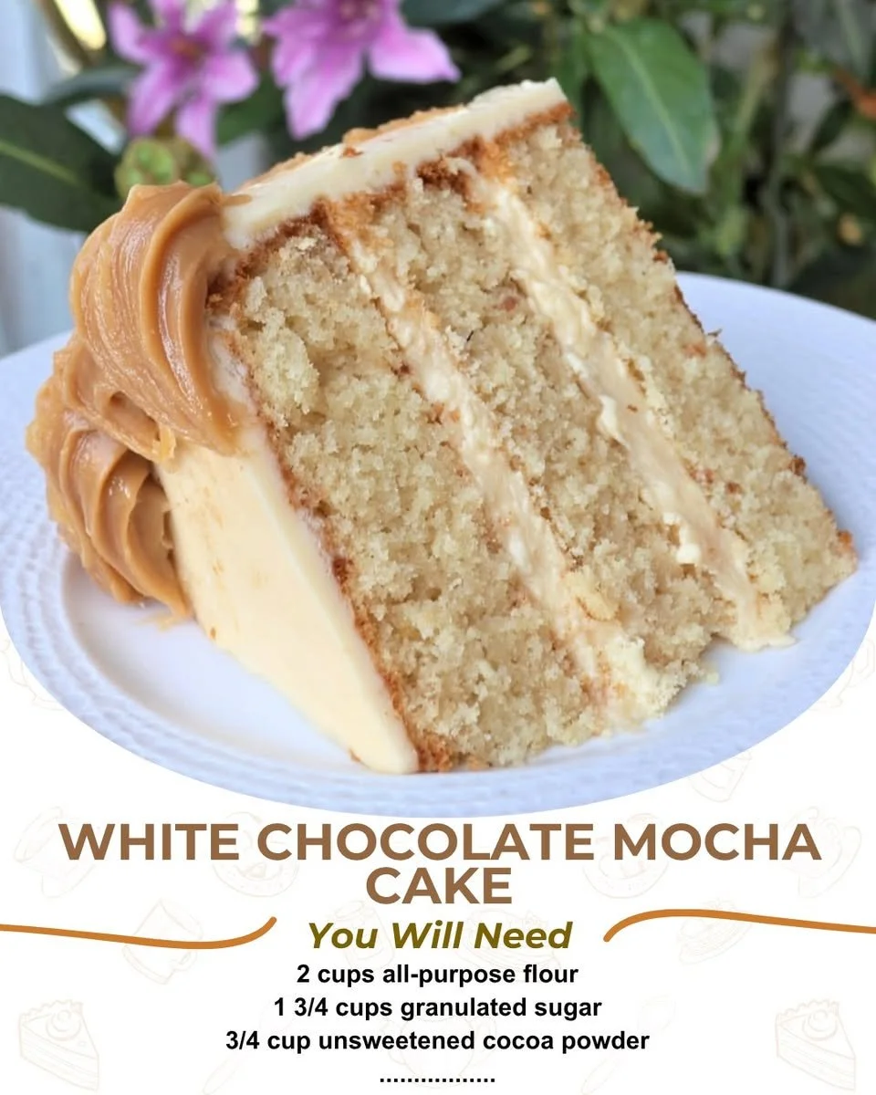Delicious White Chocolate Mocha Cake topped with creamy frosting and chocolate shavings.
